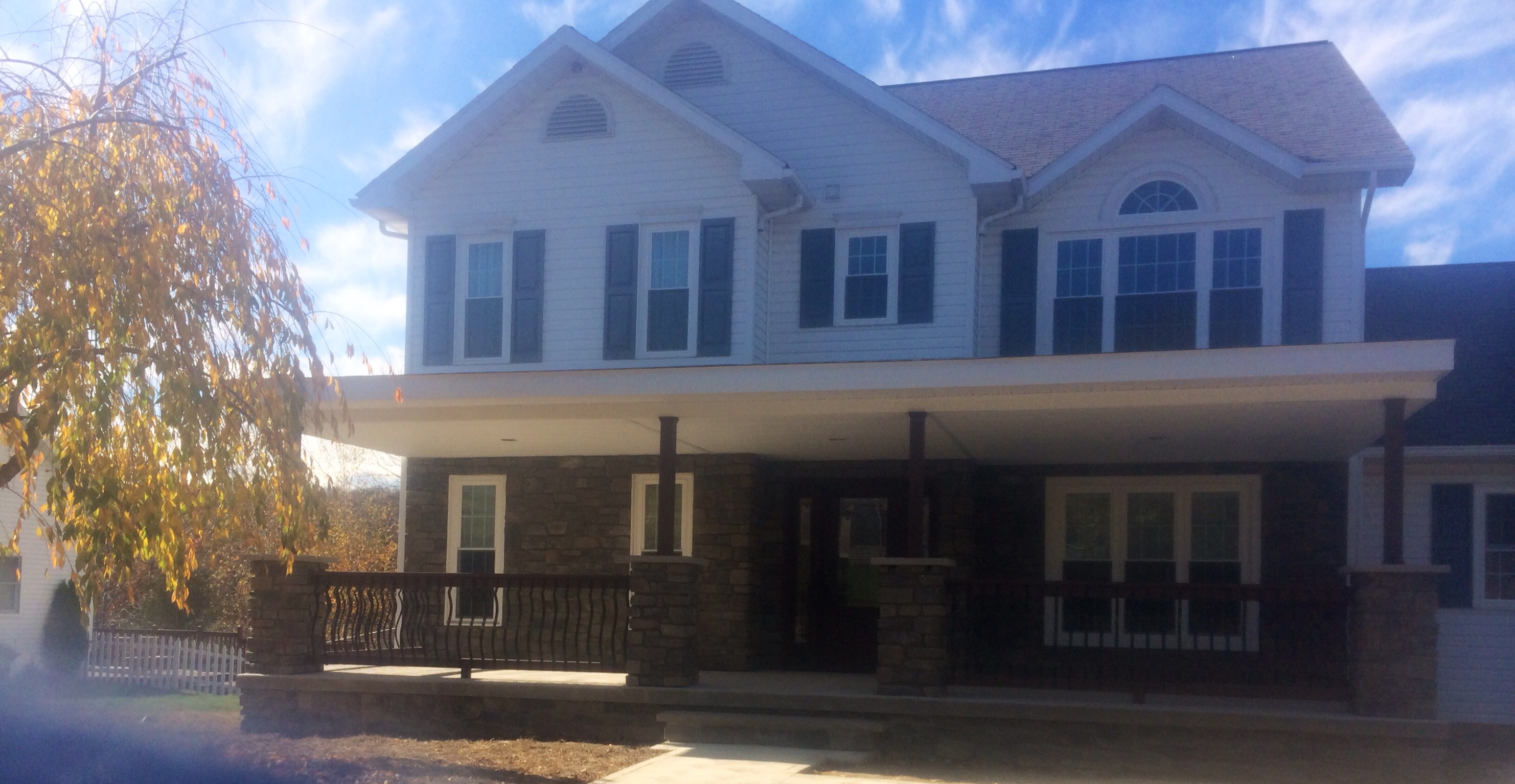 Stone patio and outdoor living space with custom masonry features